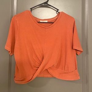 Urban Outfitters orange twist cropped tee